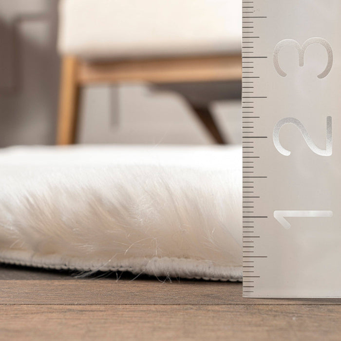 Eline Faux Sheepskin Machine Washable Area Rug: White / Shaped / 2' x 6'